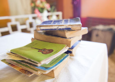 A stack of Quechua literature sits on the church altar.